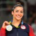 Gymnast Aly Raisman Champions Self-Care In A Bathrobe By The Fire