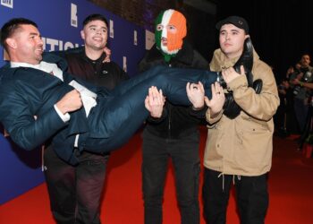 Member of Irish rap trio Kneecap charged with a terror offense in the UK