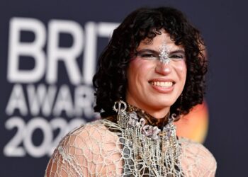 Jacob Alon raises Palestine scarf during Sharon Osbourne’s speech at 2026 BRIT Awards